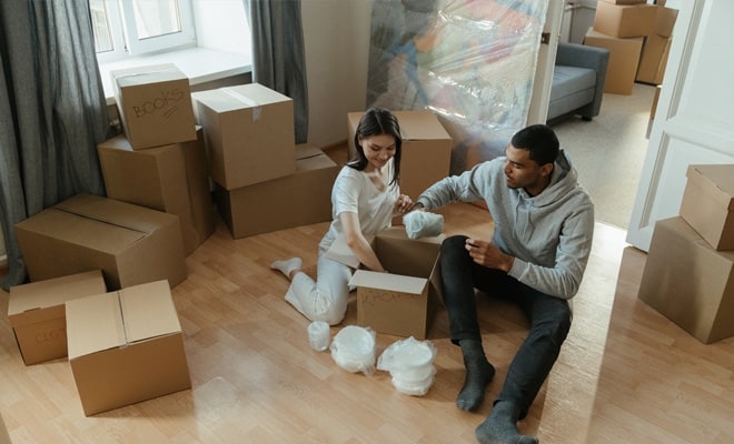 Couple packing up items from the house